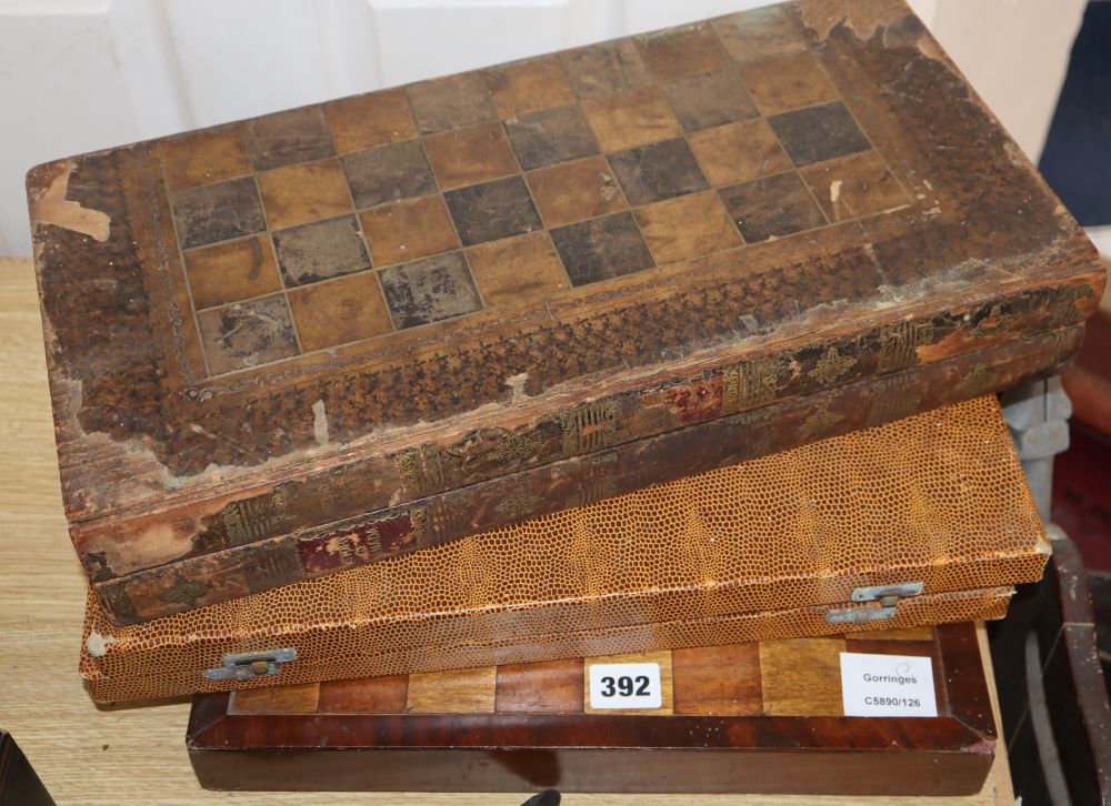 Three chess / backgammon boards and a few pieces